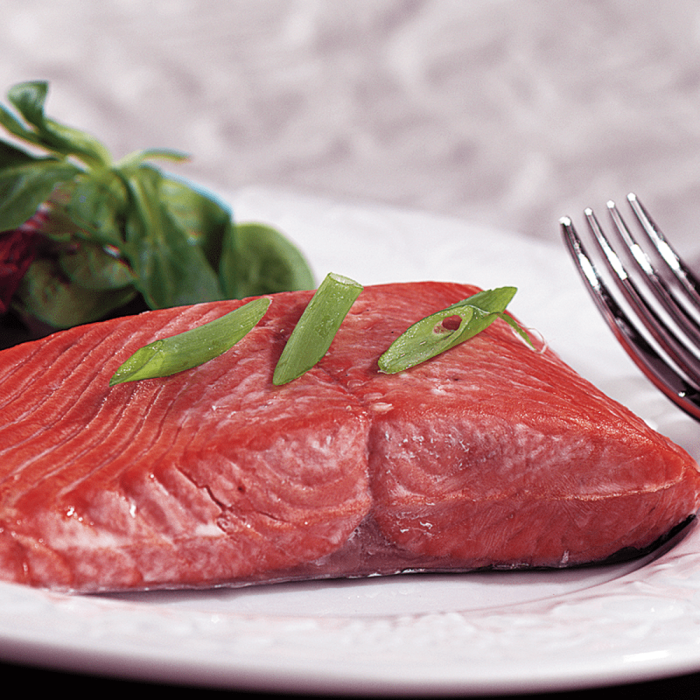 Fresh Sockeye Salmon Fillets displayed on a clean, white surface.