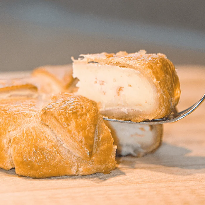 A delicious King Crab and Brie Pastry, golden brown and freshly baked.
Layers of French Brie cheese and Alaska King Crab meat