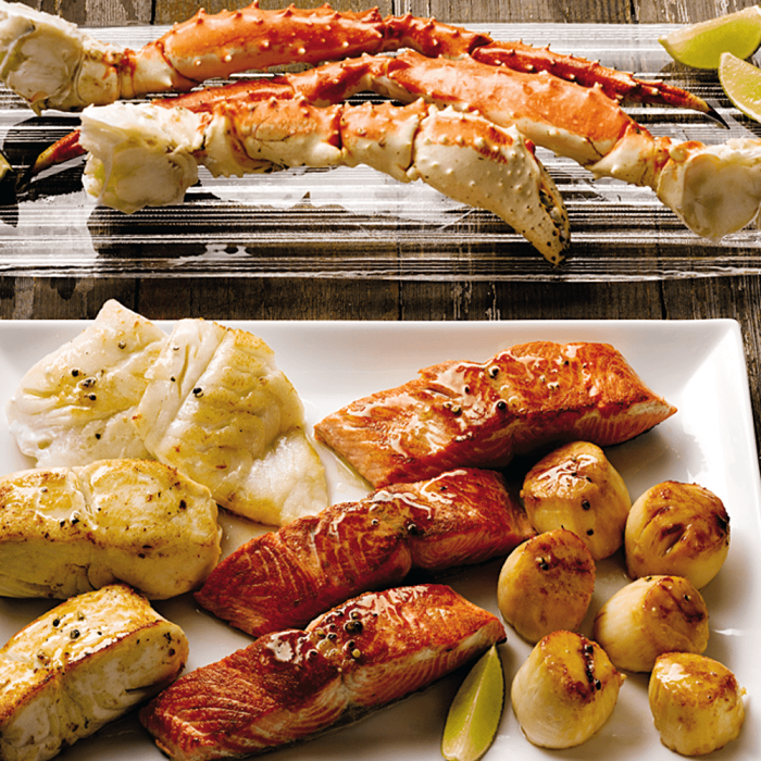 A variety pack of Alaskan Harvest seafood, including various types of wild-caught fish and shellfish.