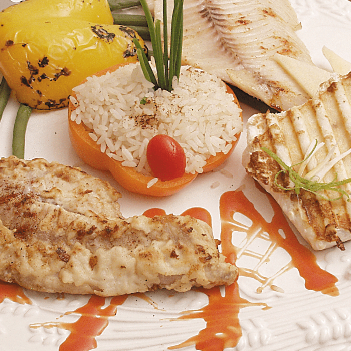 A variety of fresh whitefish including Black Cod, Halibut, and Rockfish, presented as a sampler pack.