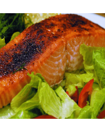 Fresh King Salmon fillets displayed on a clean, white surface.
