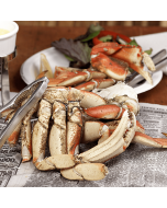 Fresh Dungeness Crab Sections displayed on a clean surface.