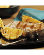 Fresh tuna steaks displayed on a clean surface.