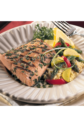 Fresh King Salmon fillets displayed on a clean, white surface.