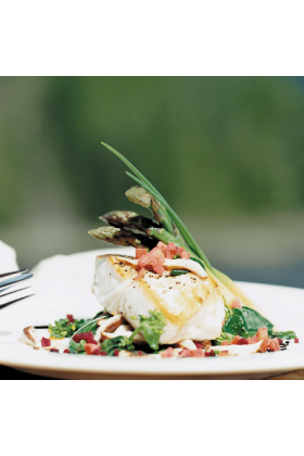 Freshly caught Halibut fillets displayed on a clean surface.