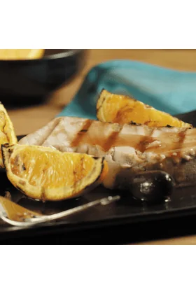 Fresh tuna steaks displayed on a clean surface.