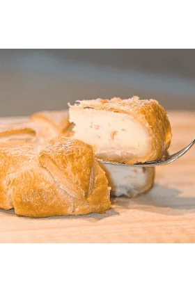 A delicious King Crab and Brie Pastry, golden brown and freshly baked.
Layers of French Brie cheese and Alaska King Crab meat