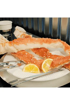 A display of the Super Jumbo King Crab Special, showcasing the largest king crab crab legs with a rich, vibrant color indicating freshness and high quality.