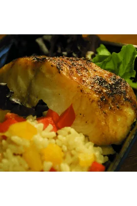 A fresh Black Cod fish displayed on a clean surface.