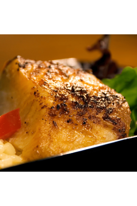 A fresh Black Cod fish displayed on a clean surface.