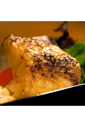 A fresh Black Cod fish displayed on a clean surface.
