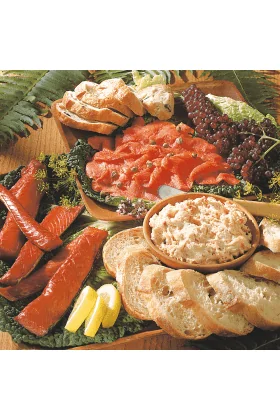 A variety of smoked meats presented in the Smokehouse Sampler product.