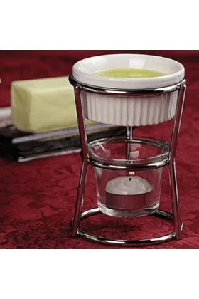 Two butter warmers with small handles and a pouring spout, perfect for melting and serving butter.
